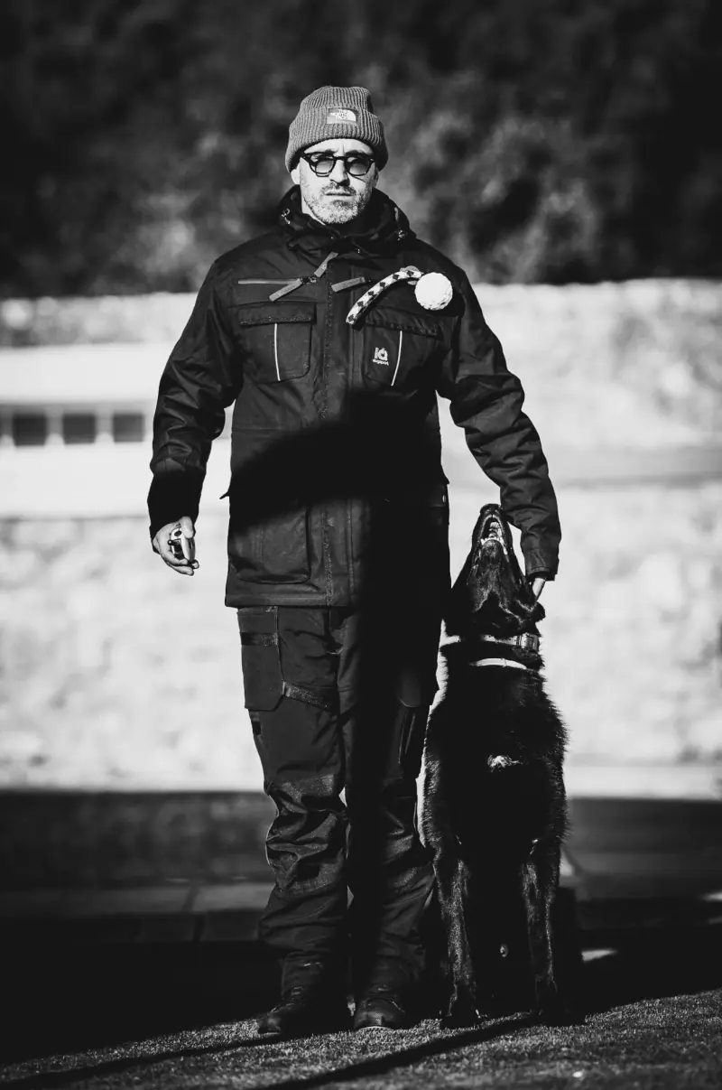Rui Navarro with a black German Shepherd